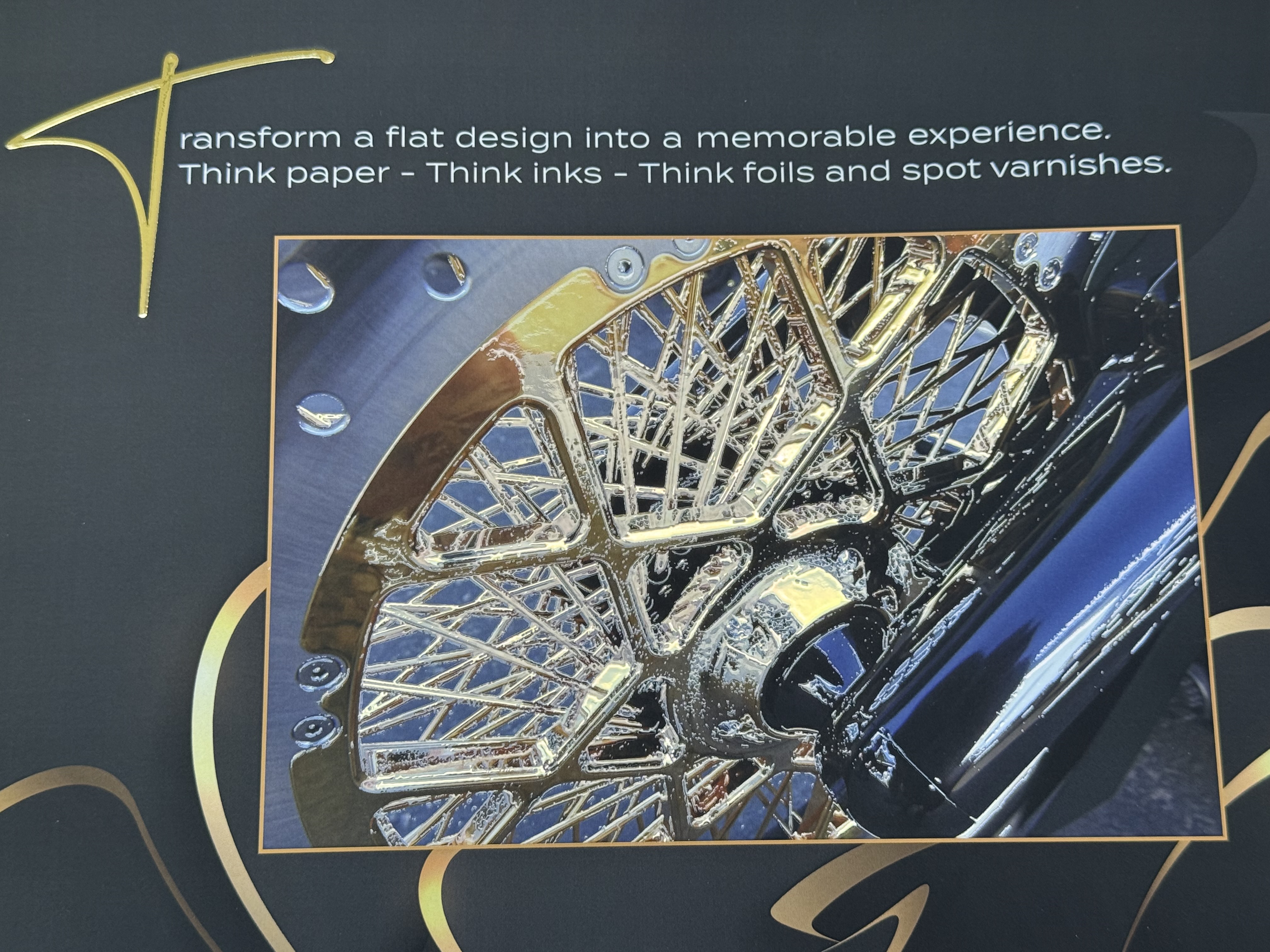 Embellished print featuring a metallic bicycle wheel