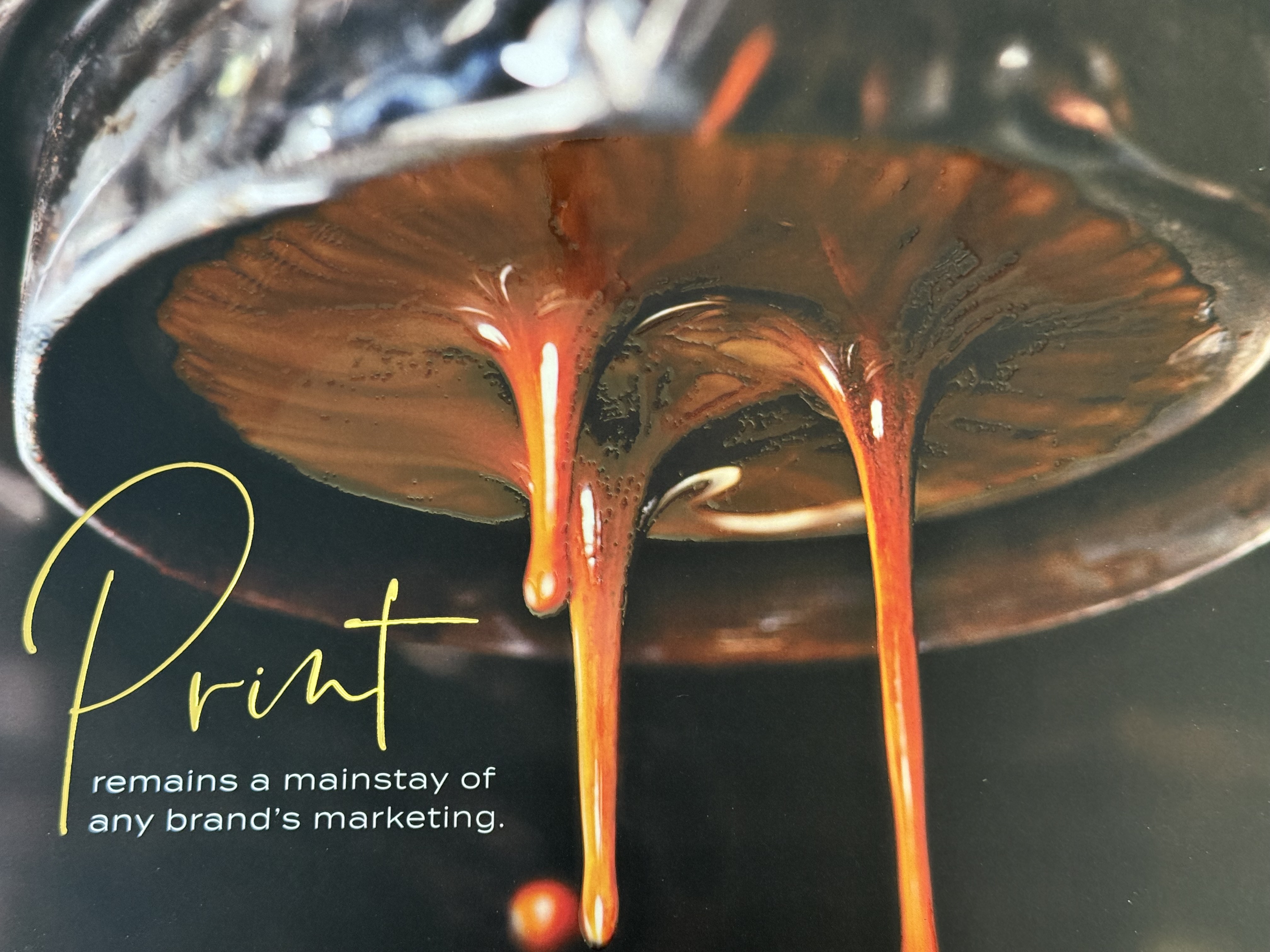 Close-up of a glossy, dripping print embellishment effect